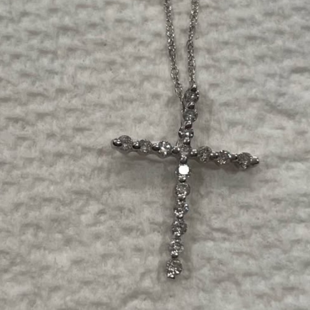 Platinum diamond cross and platinum chain.